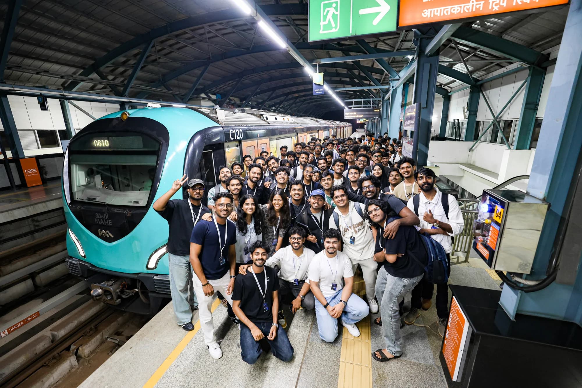 Codex Nightline builders waiting on the Kochi Metro platform